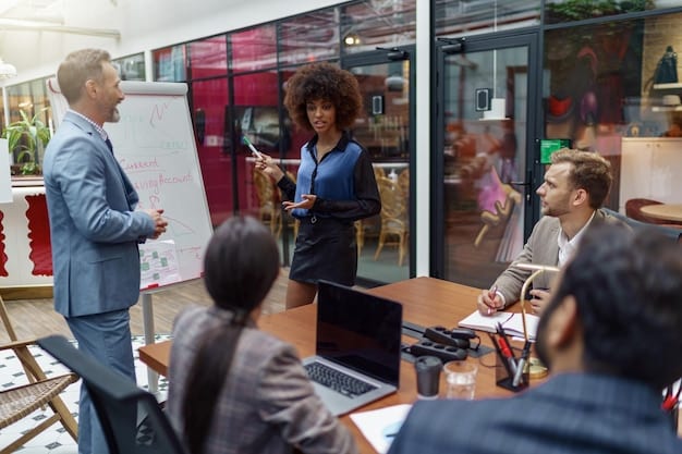 A diverse group of small business owners attending a workshop with a speaker pointing to a presentation about future growth strategies and economic resilience.