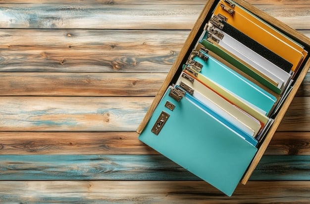 A stack of neat file folders, each tabbed and labeled, with a pen resting on top, signifying organization and preparation of documents.