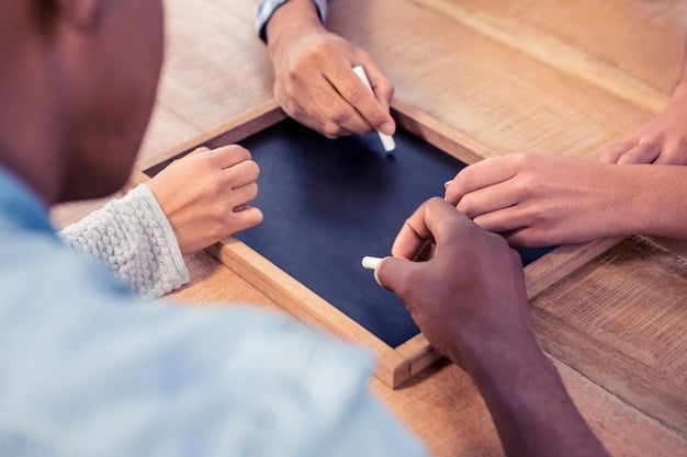 A close-up of hands (adult and child) pointing to an Individualized Education Program (IEP) document, with blurred diverse classroom in the background, symbolizing collaborative planning.